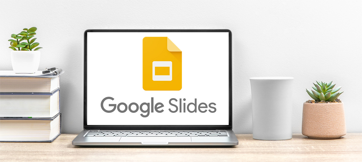 Laptop with Google Slides icon displayed.