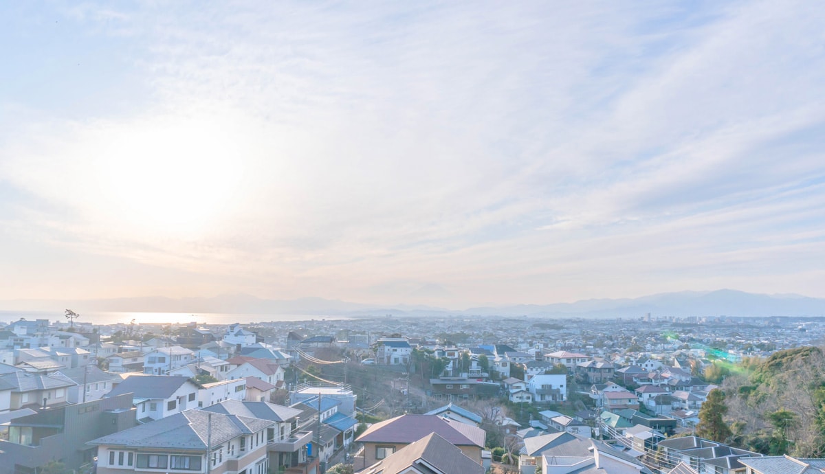 Skyview of sunset overlooking the roofs of neighborhood homes
