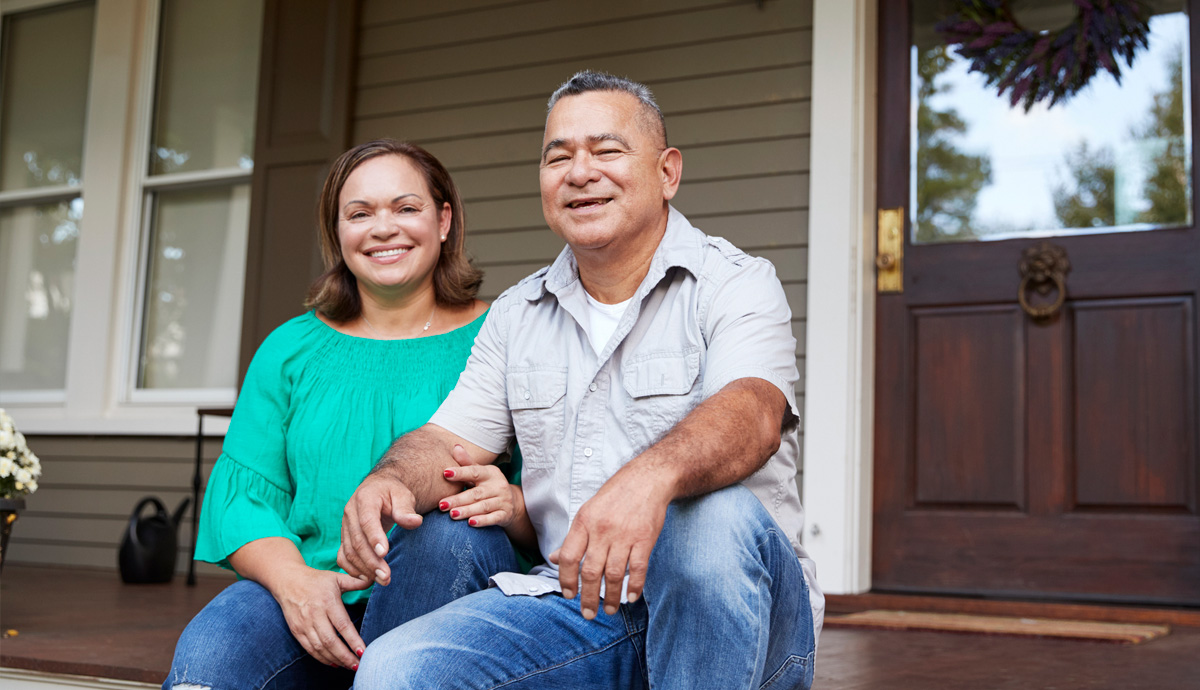 Couple sitting on their porch.